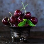 Dark Red Cherries in a Stainless Bowl